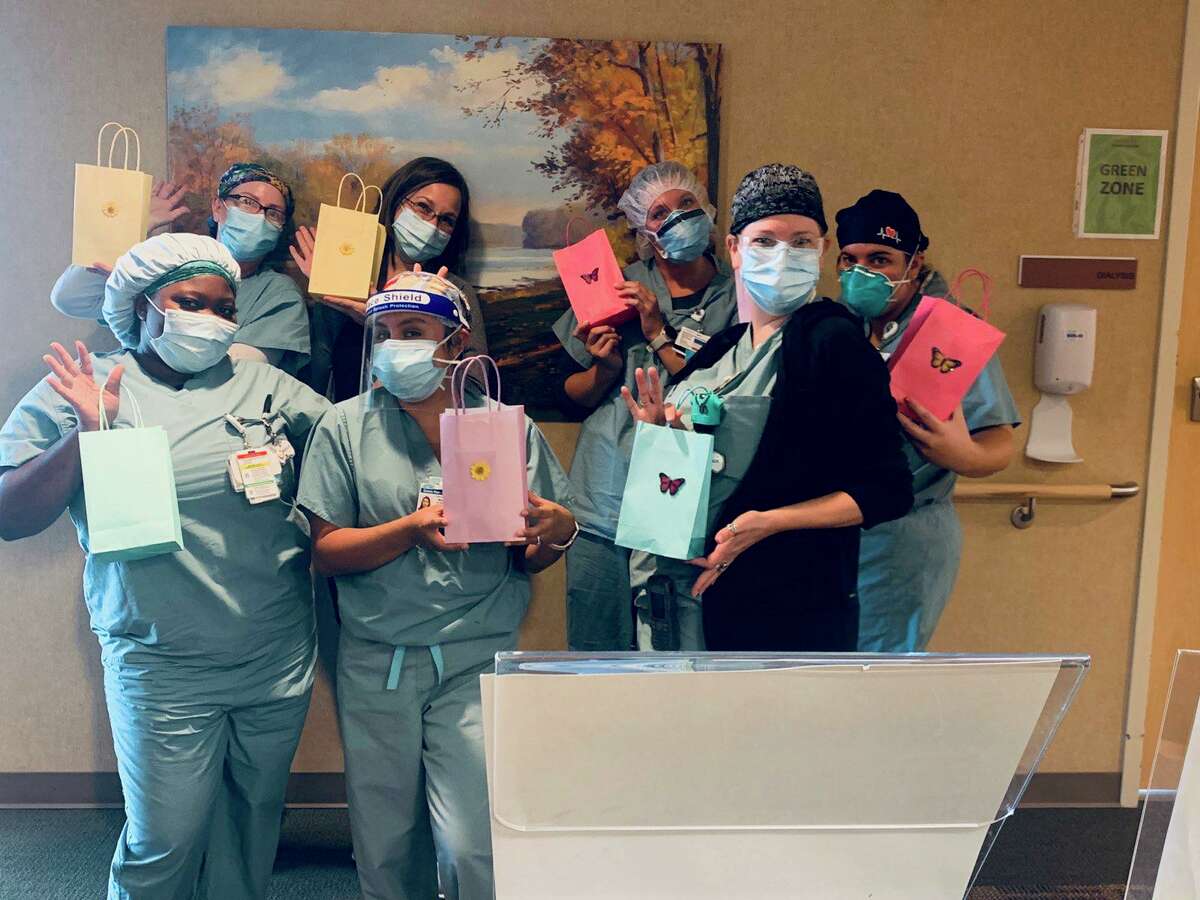 Staff at CHI St. Luke's The Woodlands Hospital are pictured with their support bags from the Catholic Chaplains Corps. Volunteers with the CCC are no longer allowed in the hospital for pastoral visits, but they are supporting the staff with support bags.