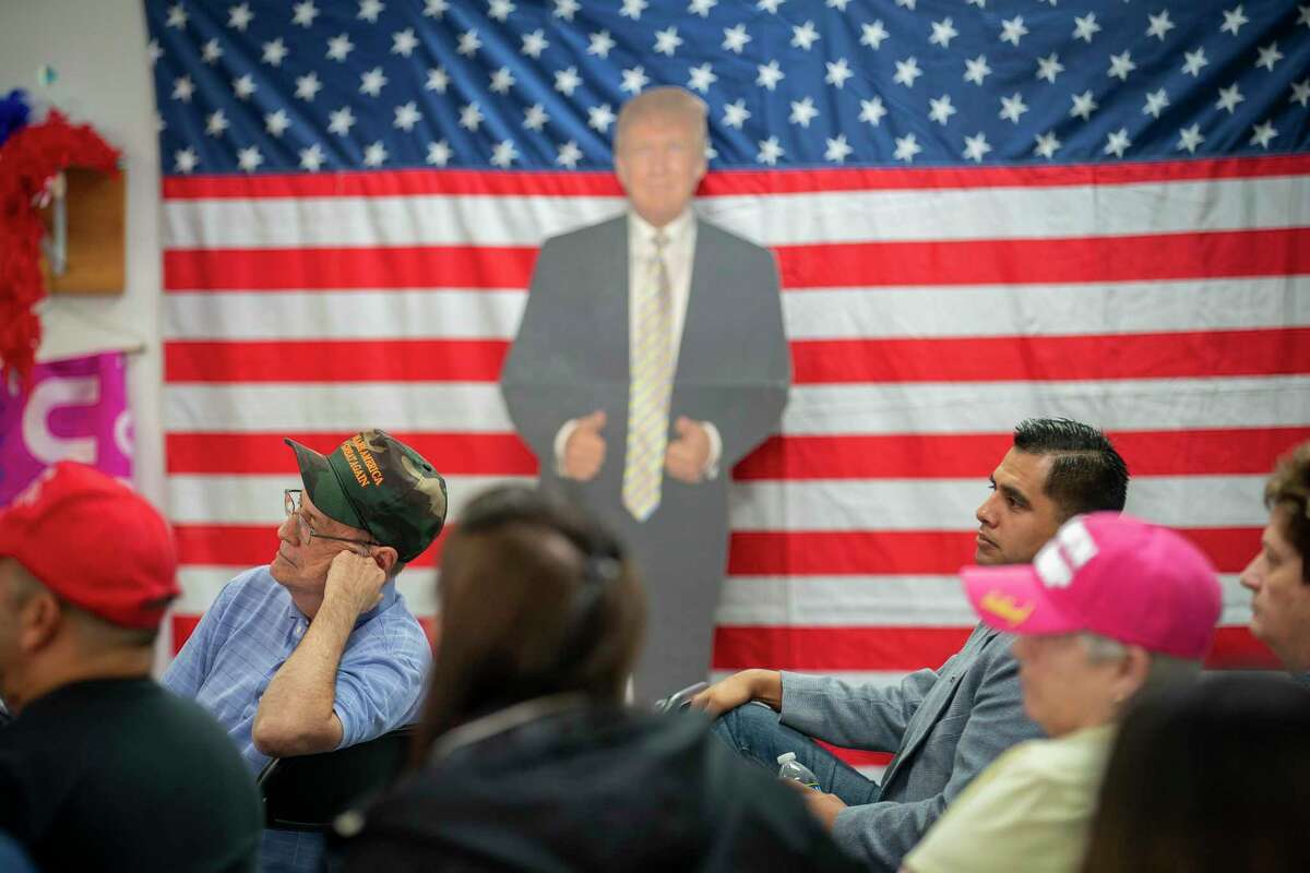 People listen during an event for veterans and second amendment supporters at the Trump campaign office in Katy, TX, Friday, Sept. 25, 2020.
