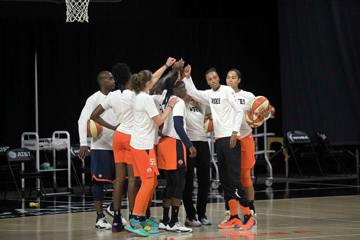 Connecticut Sun players huddle during warmups before Game 5 of their semifinal round playoff series against the Las Vegas Aces on Tuesday.