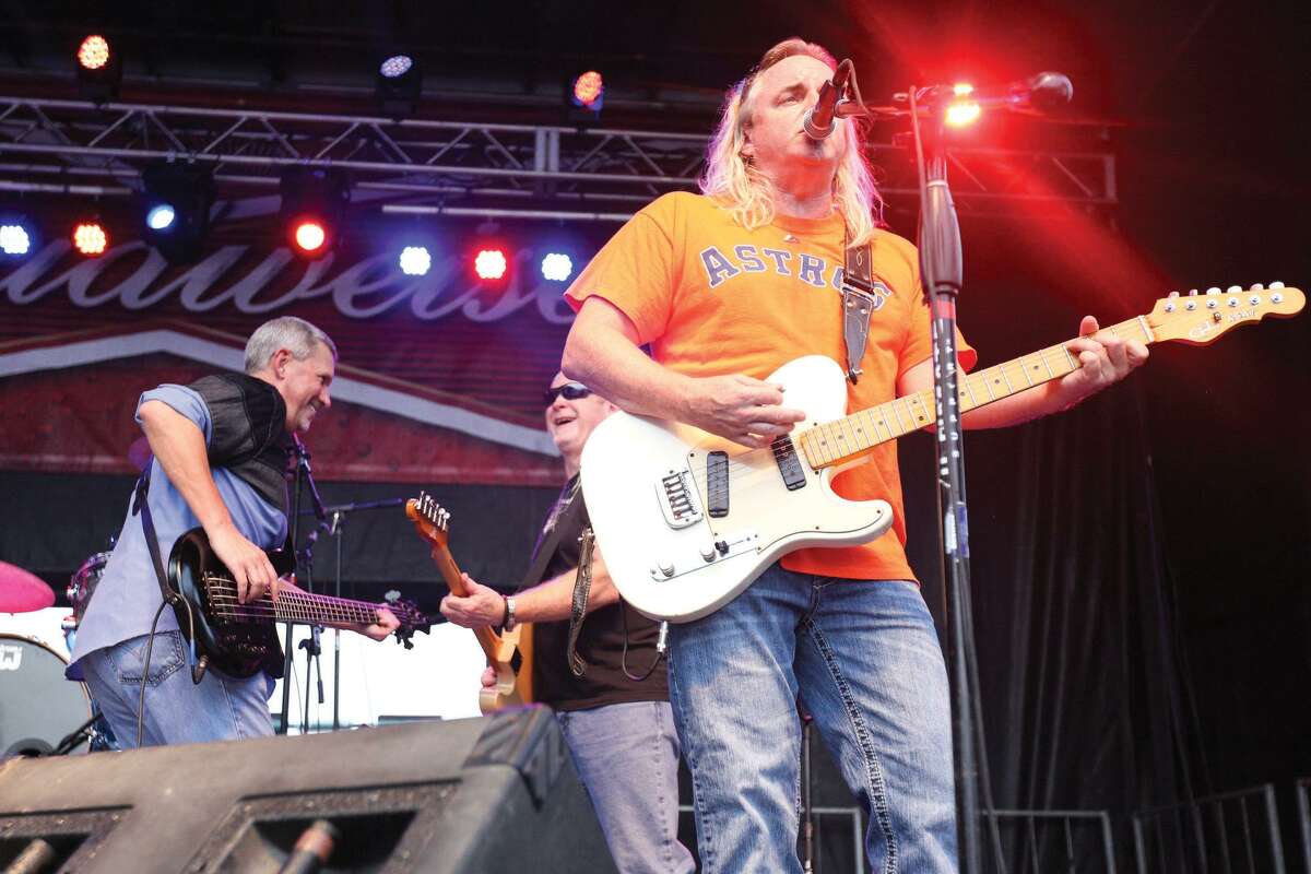 Bayou Roux performs on the Cajun Stage during the Conroe Cajun Catfish Festival on Friday night in downtown Conroe.