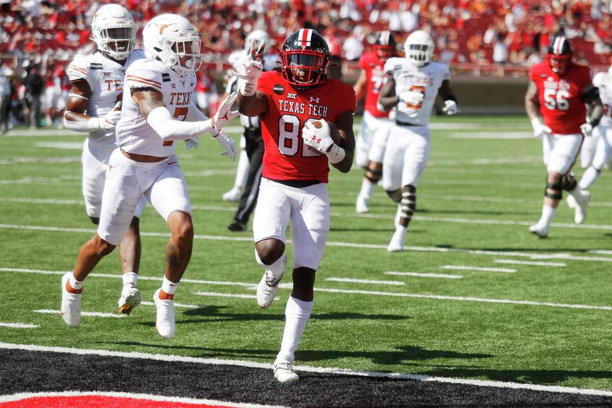 Texas Tech wide receiver Kesean Carter holds up two fingers as he scored his second touchdown of the game during the first half of an NCAA college football game against Texas Tech, Saturday Sept. 26, 2020, in Lubbock, Texas. (AP Photo/Mark Rogers)