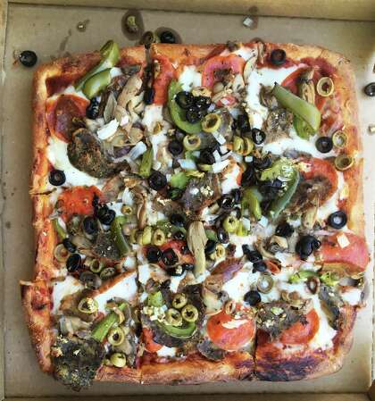 The Angelo's Special with a Sicilian-style crust at Little Italy Restaurant & Pizzeria is a formidable pizza with lots of toppings.