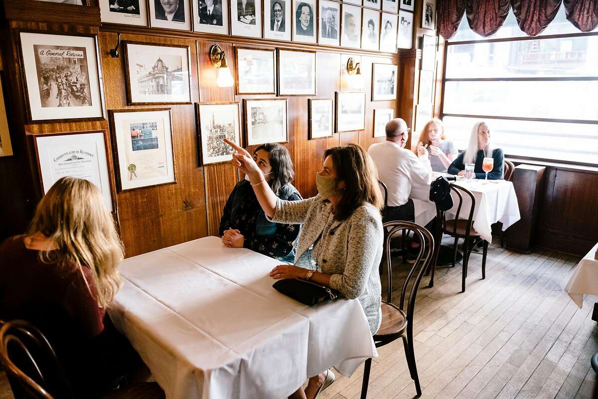 Guests dine indoors at John's Grill in San Francisco, Calif. On Tuesday, city officials announced plans to stop indoor dining starting Friday.
