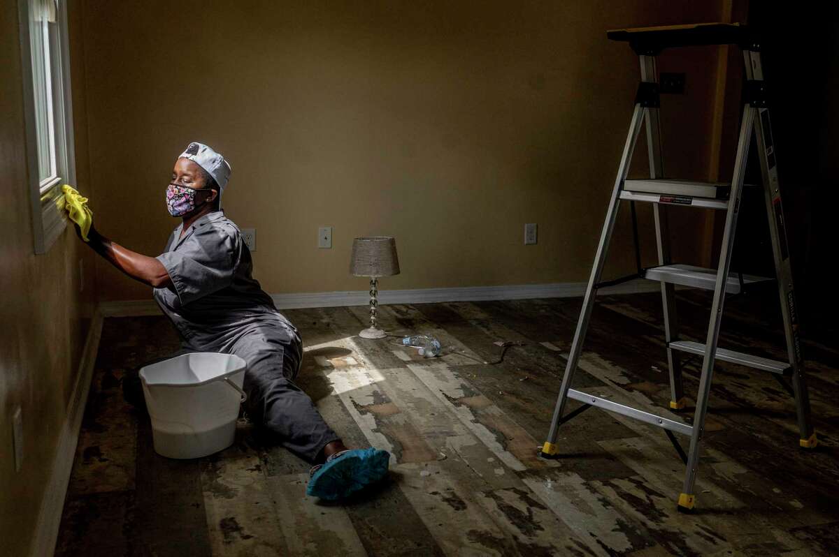 Ally Detrick cleans a client's home for a reduced rate in New Orleans on Saturday, Sept 27, 2020.