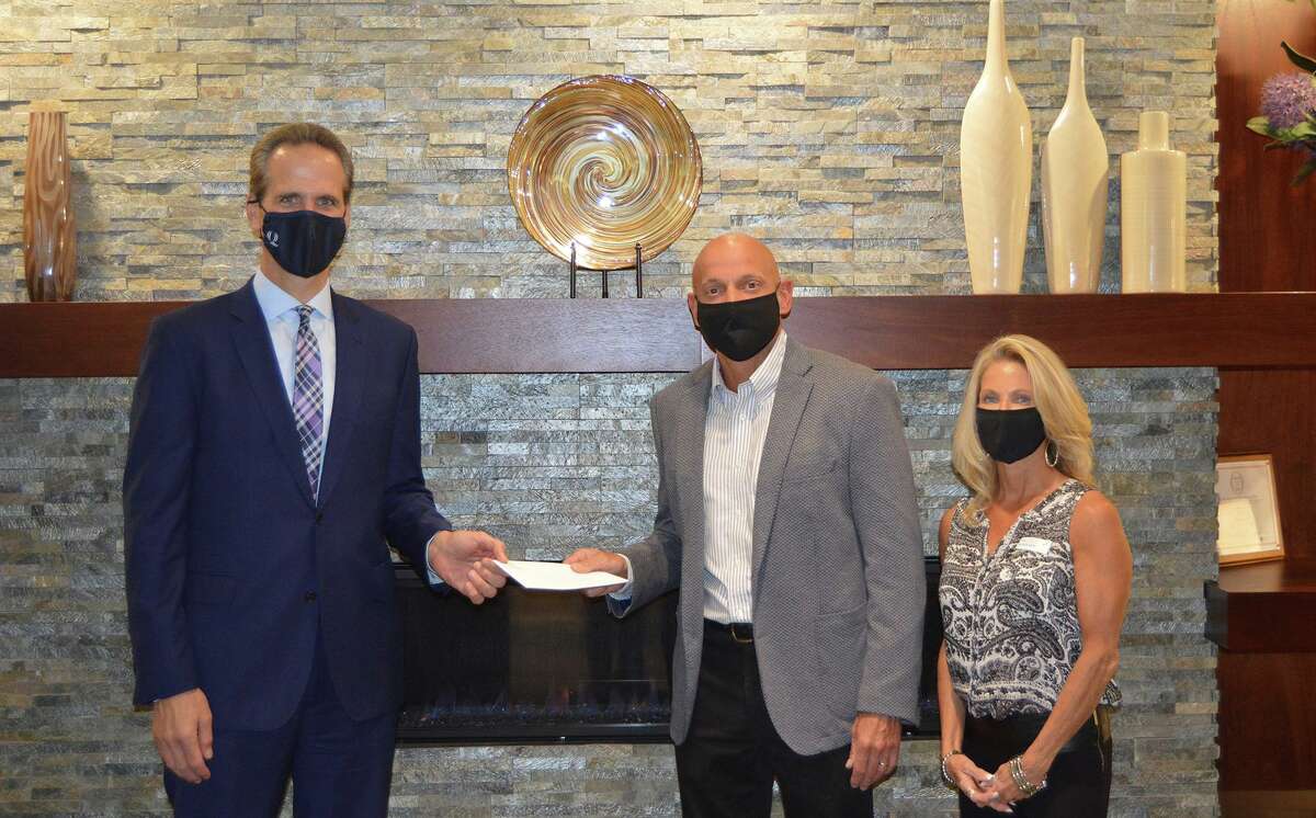 Chris, center, and Jill Douglas of Shelton recently presented Griffin Health President and CEO Patrick Charmel with a donation to support Griffin's Surgical Expansion Campaign. The donation was a combination of a personal gift from the Douglas family and a match from The Own Your Future Foundation Inc.