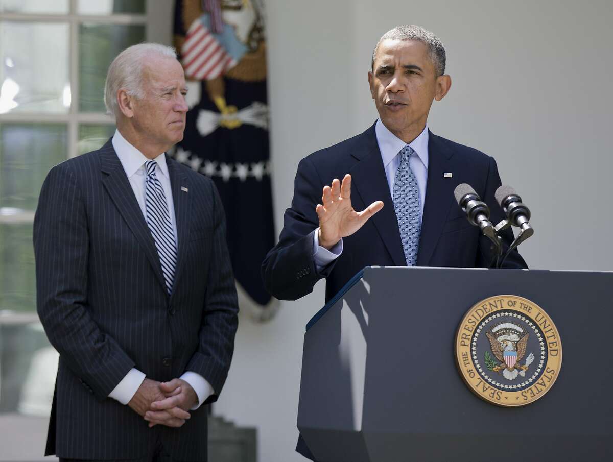 President Barack Obama, accompanied by Vice President Joe Biden, speaks about immigration reform, Monday, June 30, 2014, in the Rose Garden of the White House in Washington. The president said he's done waiting for House Republicans to act on immigration. He says he now plans to act on his own. Obama announced his intention Monday to take executive action. (AP Photo/Manuel Balce Ceneta)