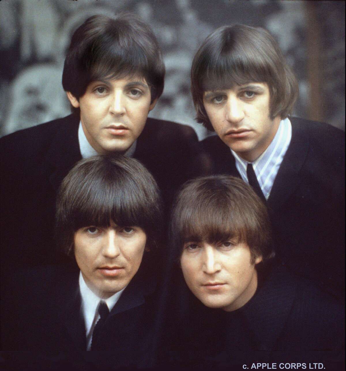 The Beatles are shown on an album cover in 1965. The set-list features many songs that John never actually played live, Rosenay noted.
