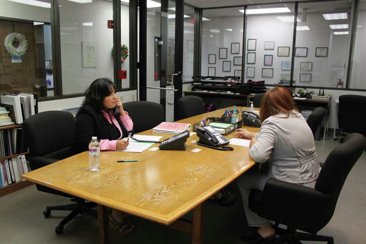 Volunteers answer calls made to the Family Violence Center hotline at Northwest Assistance Ministries.