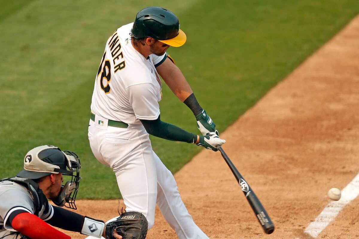 Oakland Athletics' Chad Pinder hits a 2-run single in 5th inning against Chicago White Sox during Game 3 of Wild Card Series at Oakland Coliseum in Oakland, Calif., on Thursday, October 1, 2020.