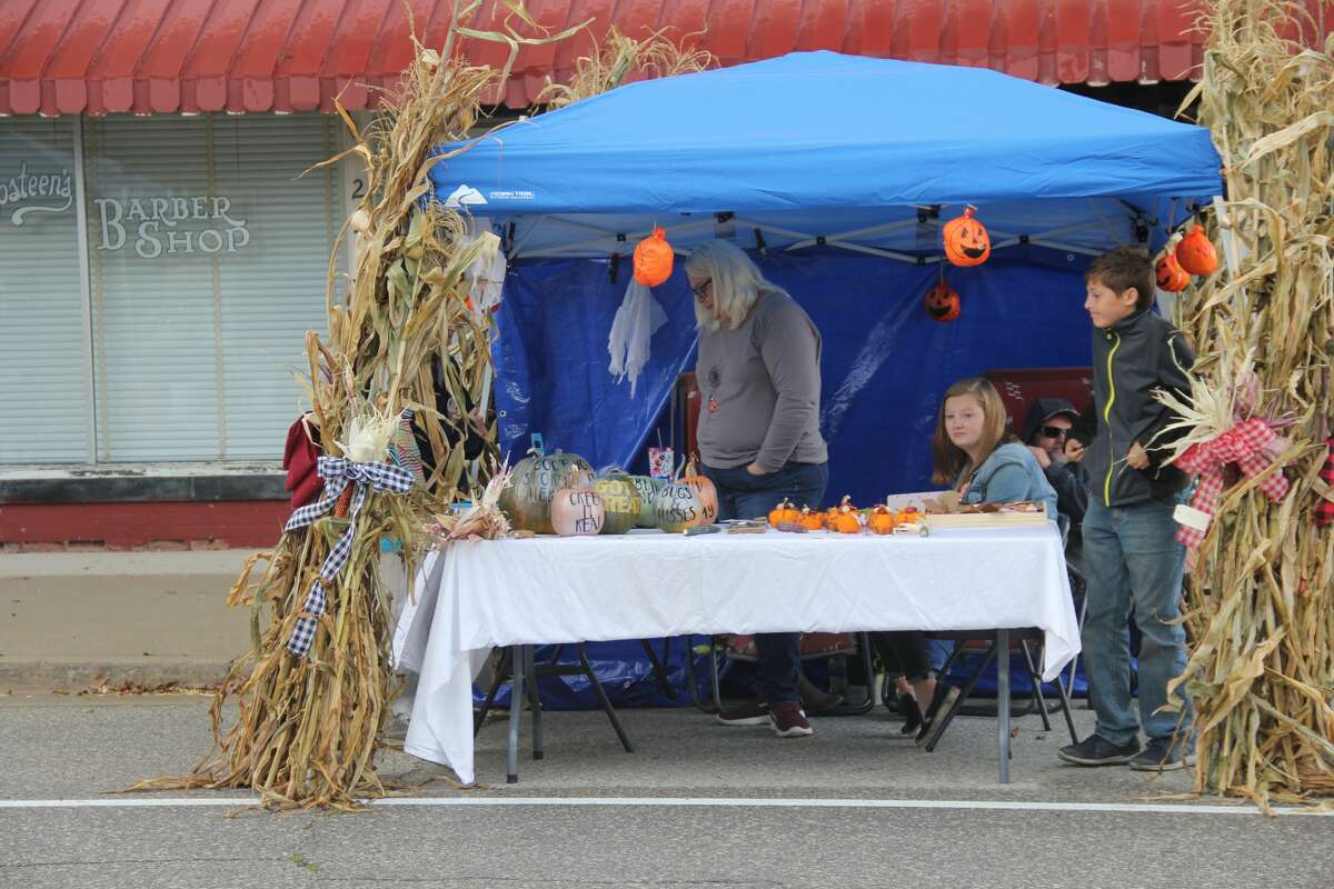 Sebewaing residents braved the rain to see what the village's Moonlight Madness and River Fire had to offer. Vendors lined Center Street to sell autumn goods while storefronts offered their own ways of getting people to come inside.