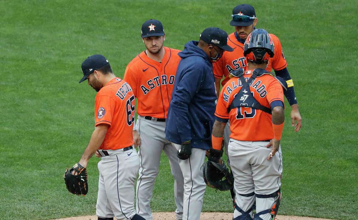 Astros manager Dusty Baker, center, lifted starting pitcher Jose Urquidy, left, after 4 1/3 innings in Game 2 against the Twins but had the luxury of using starter Cristian Javier out of the bullpen for three innings.