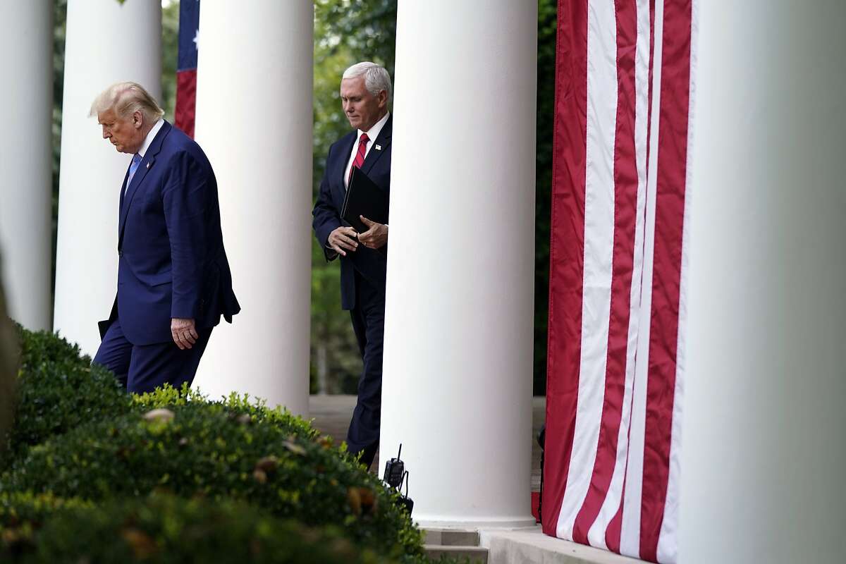 President Donald Trump arrives with Vice President Mike Pence to speak about coronavirus testing during an event in the Rose Garden of the White House on Sept. 28.