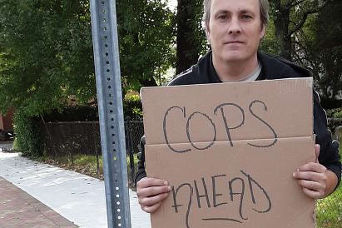 Judge: Police violated free-speech rights of CT man who held 'Cops Ahead' sign