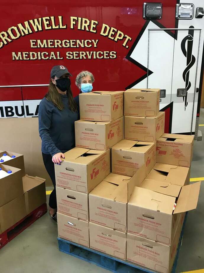 A cooperative effort involving a Delaware farmer and a cadre of local volunteers and the U.S. Department of Agriculture has provided boxes of fresh food to more than 1,100 families. Photo: Jeff Mill /