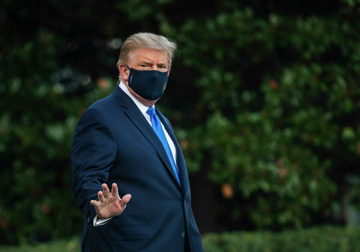 ‎President Trumps walks to Marine One on the South Lawn of the White House on Friday afternoon en route to Walter Reed Military Medical Center. After testing positive for the novel coronavirus, Trump will spend the coming days in the military hospital to undergo treatment.