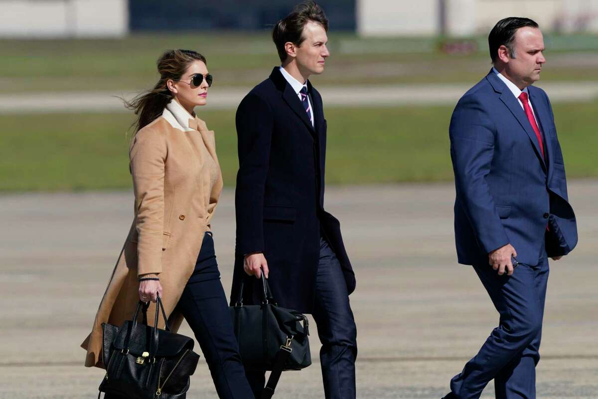 Counselor to the President Hope Hicks, left, White House adviser Jared Kushner, center, and White House Social Media Director Dan Scavino, right, walk towards Air Force One at Andrews Air Force Base, Md., Wednesday, Sept. 30, 2020. (AP Photo/Susan Walsh)