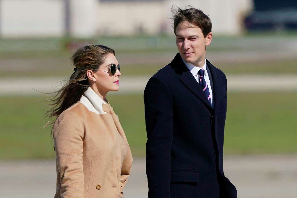 Counselor to the President Hope Hicks, left, and White House adviser Jared Kushner, right, walk towards Air Force One at Andrews Air Force Base, Md., Wednesday, Sept. 30, 2020. (AP Photo/Susan Walsh)