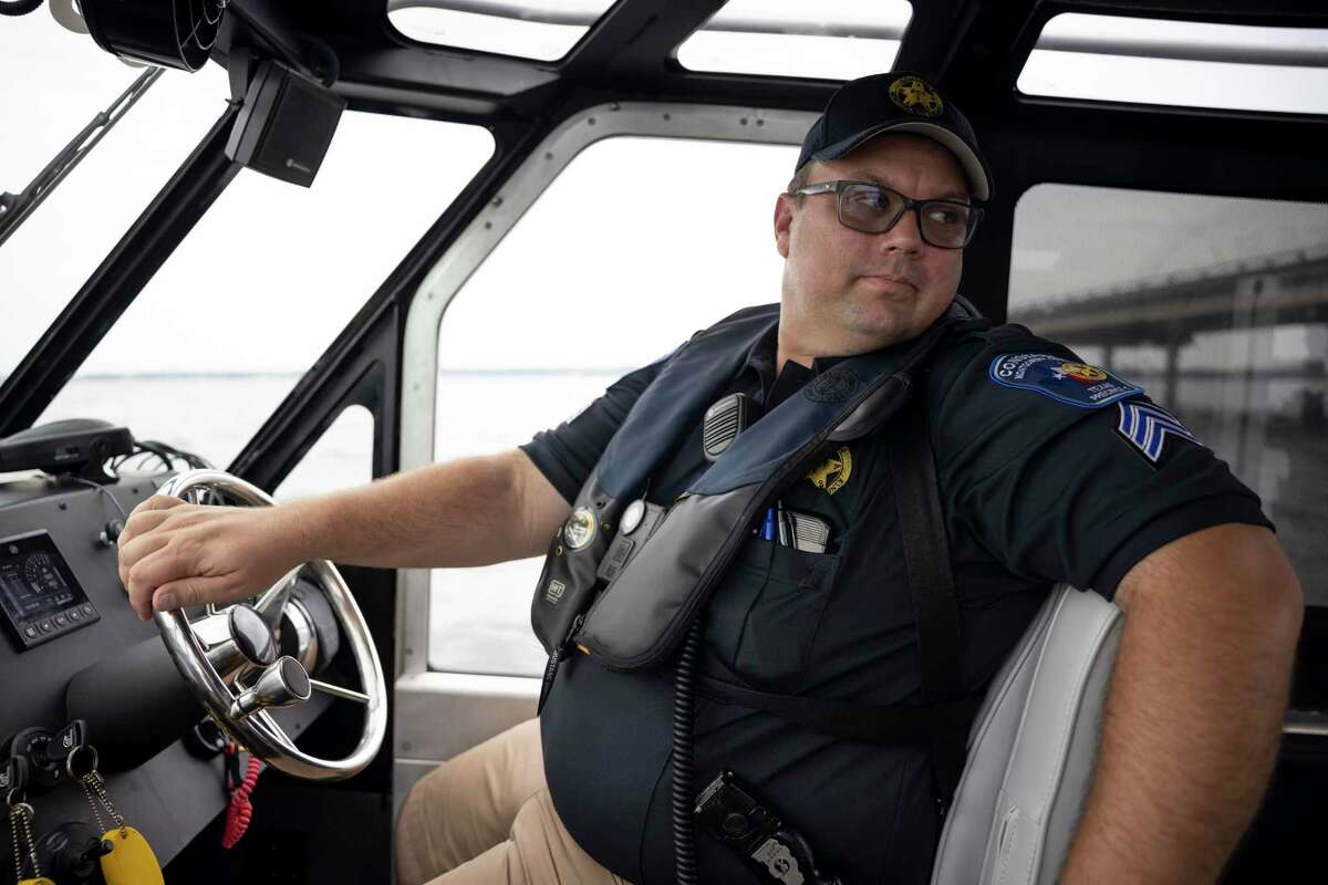 Lt. Alexander looks back at Lake Conroe as he steers a patrol boat, Saturday, Sept. 5, 2020.