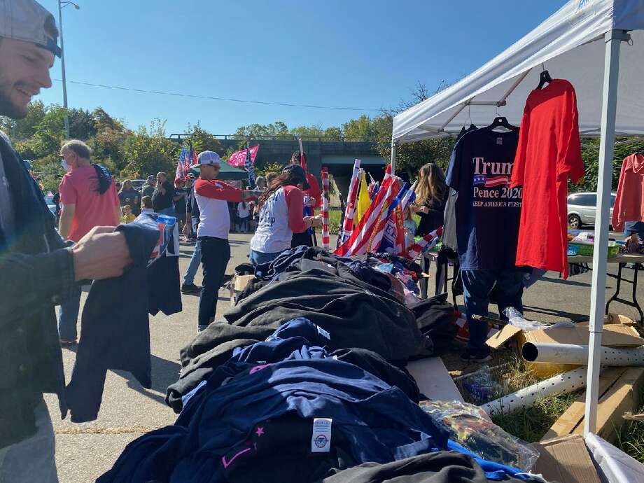 More than 250 vehicles festooned with Trump flags and signs gathered at the commuter lot in Guilford Saturday before the Back the Blue and Trump Car Parade set to begin at 11 a.m. Photo: Sara Kryz / For Hearst Connecticut Media