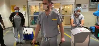 A medical team travels to obtain a heart for transplant.