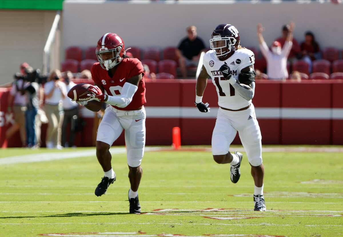 TUSCALOOSA, AL - OCTOBER 3: John Metchie III #8 of the Alabama Crimson Tide makes a catch ahead of Jaylon Jones #17 of the Texas A&M Aggies on October 3, 2020 at Bryant-Denny Stadium in Tuscaloosa, Alabama. (Photo by UA Athletics/Collegiate Images/Getty Images)