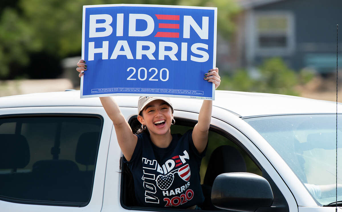 Supporters of Presidential Candidate Joe Biden show their support as they traverse Laredo with decorated cars, Saturday, Oct. 3, 2020, during the Ridin' with Biden parade.