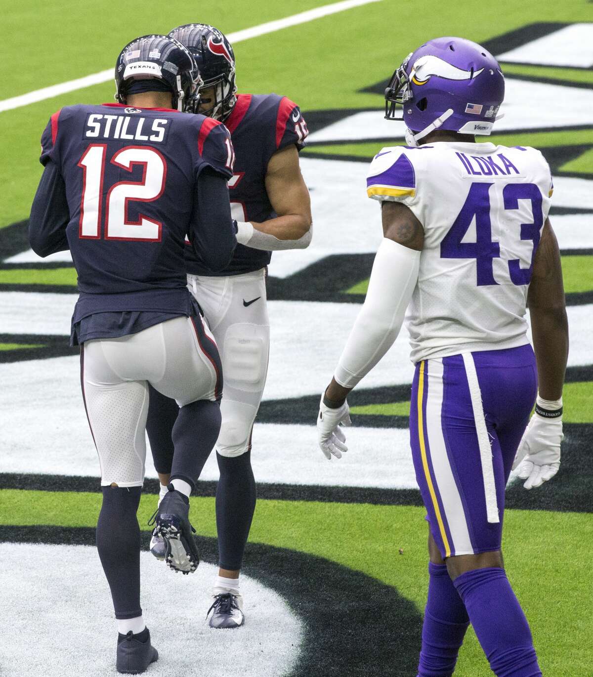 Houston Texans wide receivers Kenny Stills (12) and Will Fuller (15) celebrate Stills' 24-yard touchdown reception during the fourth quarter of an NFL football game at NRG Stadium on Sunday, Oct. 4, 2020, in Houston.