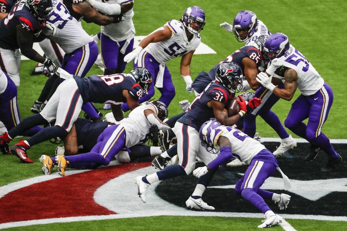 Houston Texans running back David Johnson (31) is stopped by the Minnesota Vikings defense during the first half of an NFL football game at NRG Stadium on Sunday, Oct. 4, 2020, in Houston.