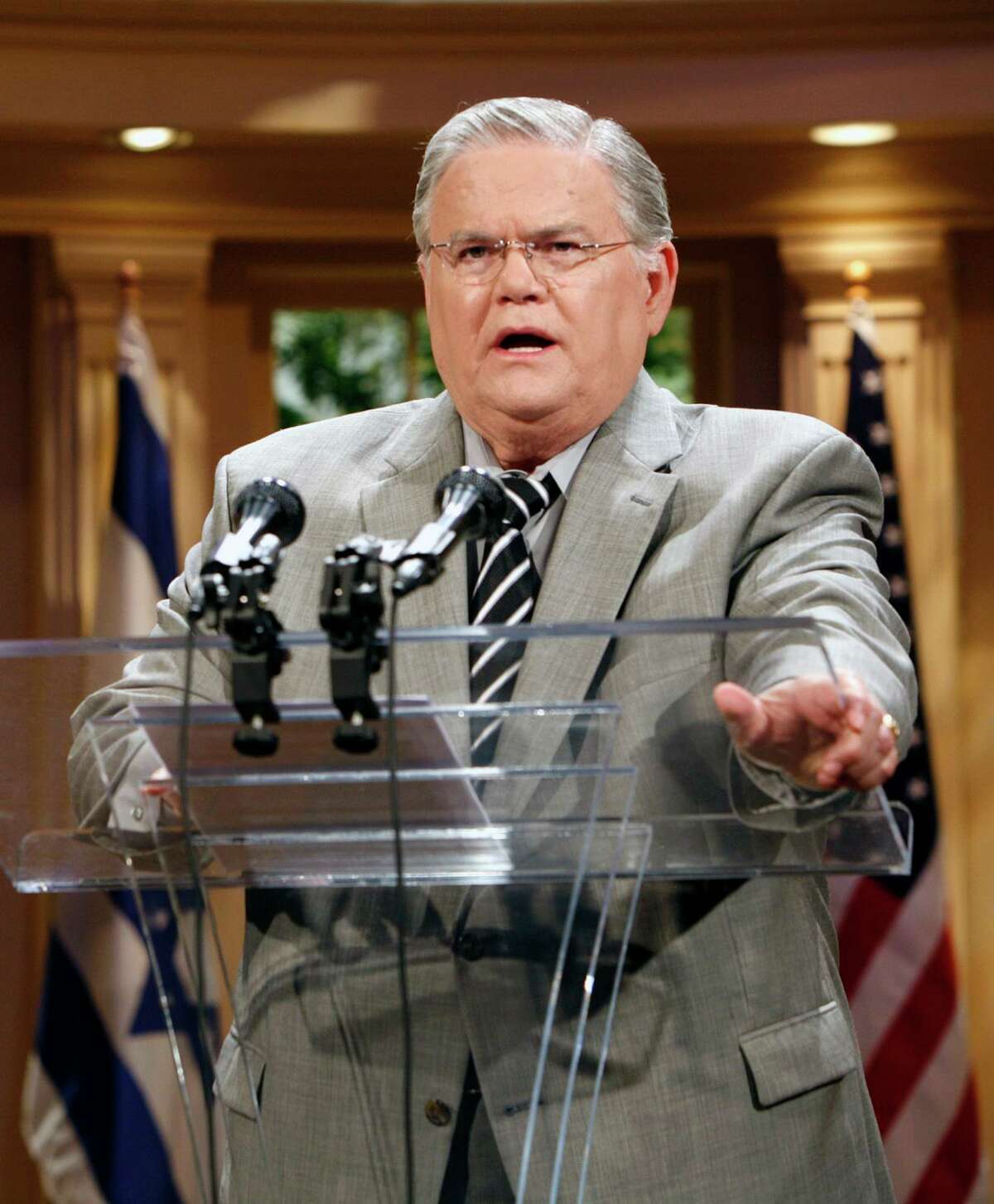 ** FILE ** In this May 23, 2008, file photo the Rev. John Hagee speaks during a news conference at the Cornerstone Church in San Antonio, Texas. Hagee, the inter- nationally known radio/TV evangelist, is recovering after undergoing open heart surgery Thursday, Oct. 2, 2008. (AP Photo /J. Michael Short, File)