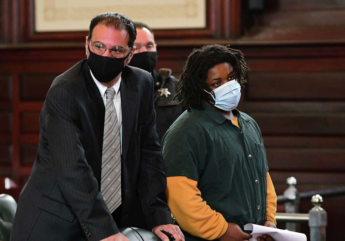 Jahquay Brown, right, stands next to Assistant Public Defendant Greg Cholakis as he is arraigned for second-degree murder in the killing of 11-year-old Ayshawn Davis at the Rensselaer County Court House on Monday, Oct. 5, 2020 in Troy, N.Y. (Lori Van Buren/Times Union)
