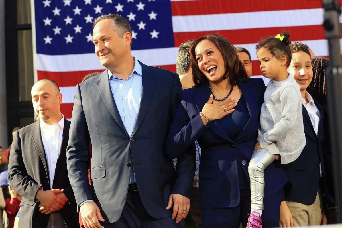 FILE -- Sen. Kamala Harris (D-Calif.), currently the Democratic nominee for vice president, is joined by her husband Doug Emhoff as she launches her presidential campaign in Oakland, Calif., on Jan. 27, 2019. Harris is holding her neice Amara Ajagu. (Jim Wilson/The New York Times)
