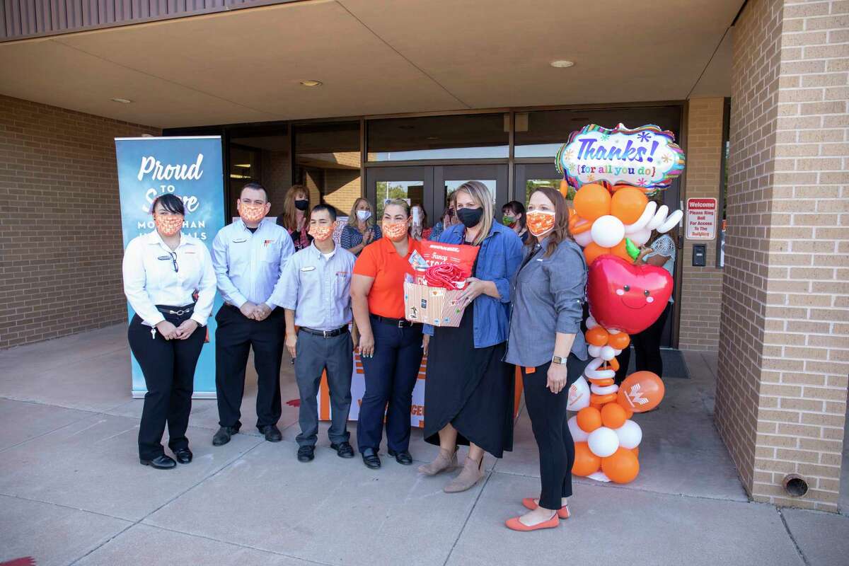 Whataburger gave eight teachers gift cards and Whataburger swag in observance of World Teachers?• Day on Monday, Oct. 5, 2020 at Parker Elementary School. Katie Cates, second from right, received the Fancy ketchup gift bucket. Jacy Lewis/Reporter-Telegram