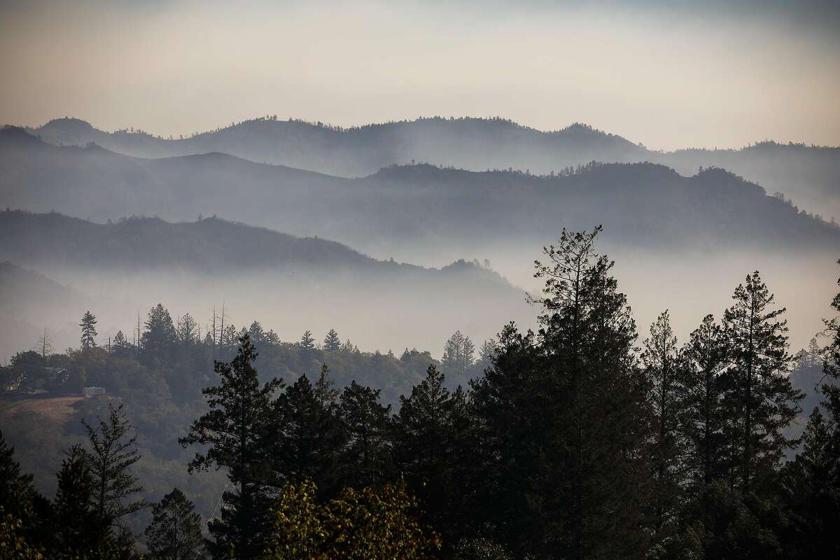 A view of smoke from the Glass Fire over the hills from Calistoga Road on Sunday, Oct. 4, 2020 in Calistoga, California.