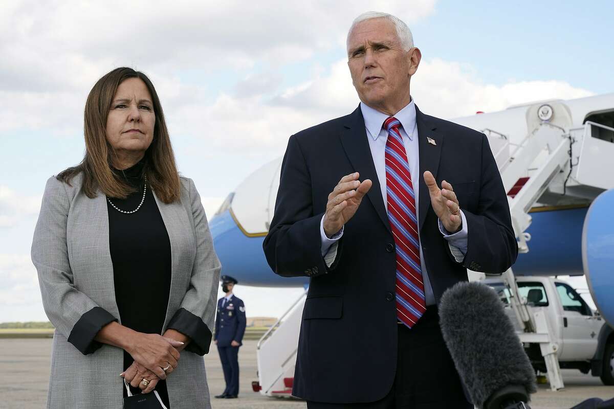 Vice President Mike Pence prepares to leave for Utah at Andrews Air Force Base, Md., with wife Karen Pence.