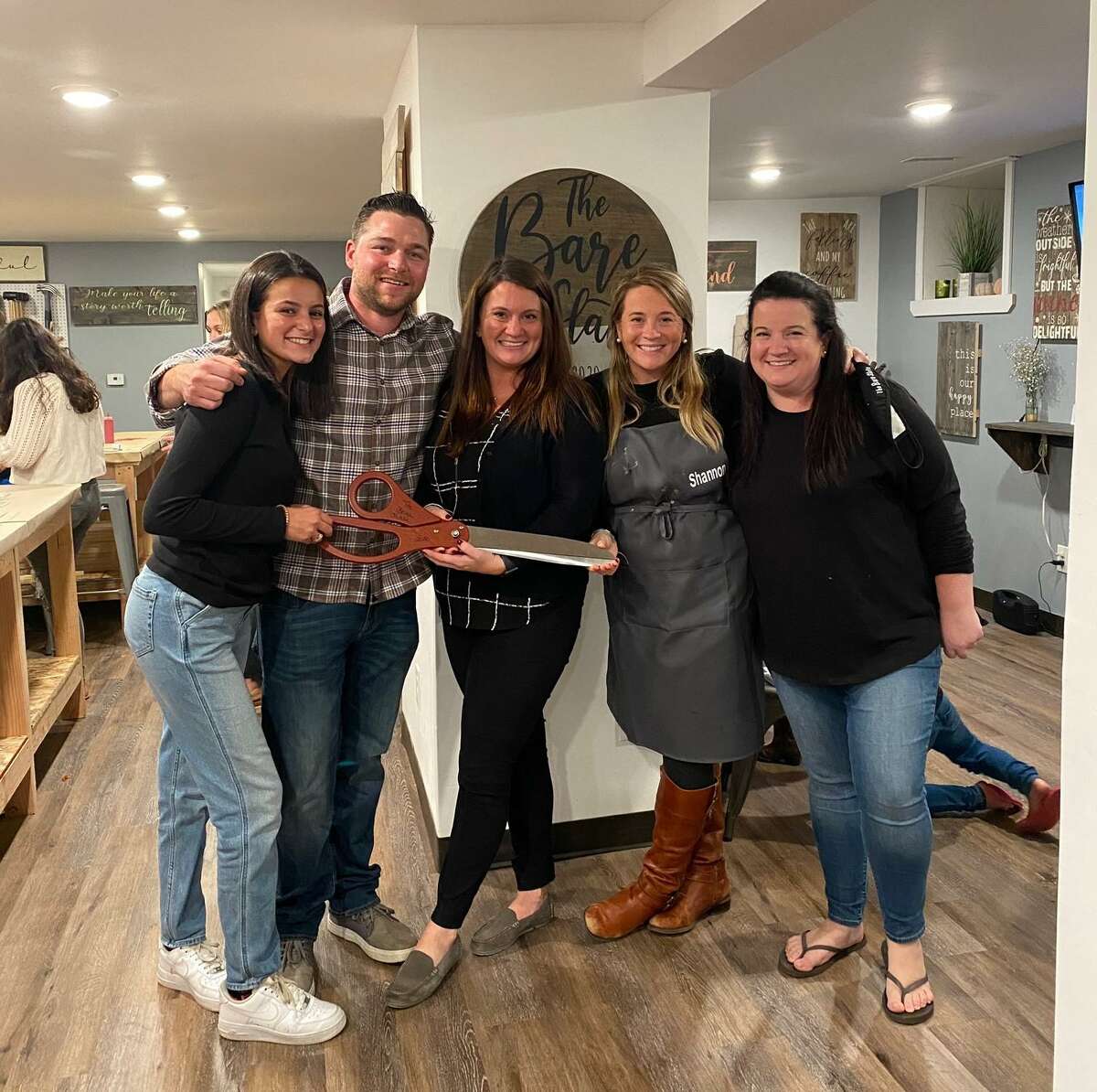 Molly Shea and Robert Davies held the grand opening Thursday, Oct. 1, for their new business, The Bare Slate. Pictured are staffers, left to right, Gabriella Perry, Davies, Shea, Shannon Ottowell and Meghan Pane. The business, which offers public and private art classes and workshops, opened its doors at 346 Coram Ave. at the corner of Coram and Center Street. The couple celebrated the new venture with a grand opening party Thursday. "What sets us apart from the rest is our ability to customize our offering to customers' needs, as well as our fantastic team," Shea said. "If you are looking for something new and exciting to do in town," Shea said, "come down to The Bare Slate to create a unique décor piece or wine glass decorating, while enjoying time with friends, family or even a fun date night." Each week, the business hosts some four to five private parties - from children's birthdays to private parties, business events to fundraisers. Instructors are available at every table for the events.