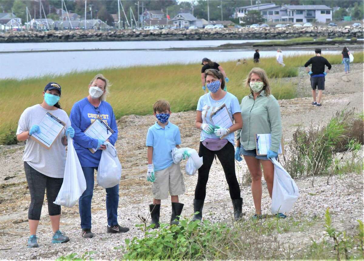 From left, third-grade teacher Alyson Cipollone, science teacher Stephanie Johnson, fourth-grader Griffin Lariviere and his mother STEAM coordinator Shari Lariviere, and Director of Admission Pam Glasser work together to preserve Grass Island at this year’s International Coastal Cleanup.