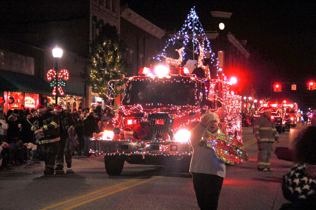 Last year, hundreds of area residents gathered to watch floats decorated in twinkling Christmas lights stroll down Michigan Avenue. Featured is a photo from last year's festivities.