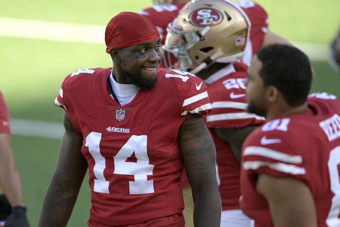 San Francisco 49ers long snapper Taybor Pepper (46) stands on the field  with punter Mitch Wishnowsky (18) before an NFL football game against the  Tampa Bay Buccaneers, Sunday, Dec.11, 2022, in Santa