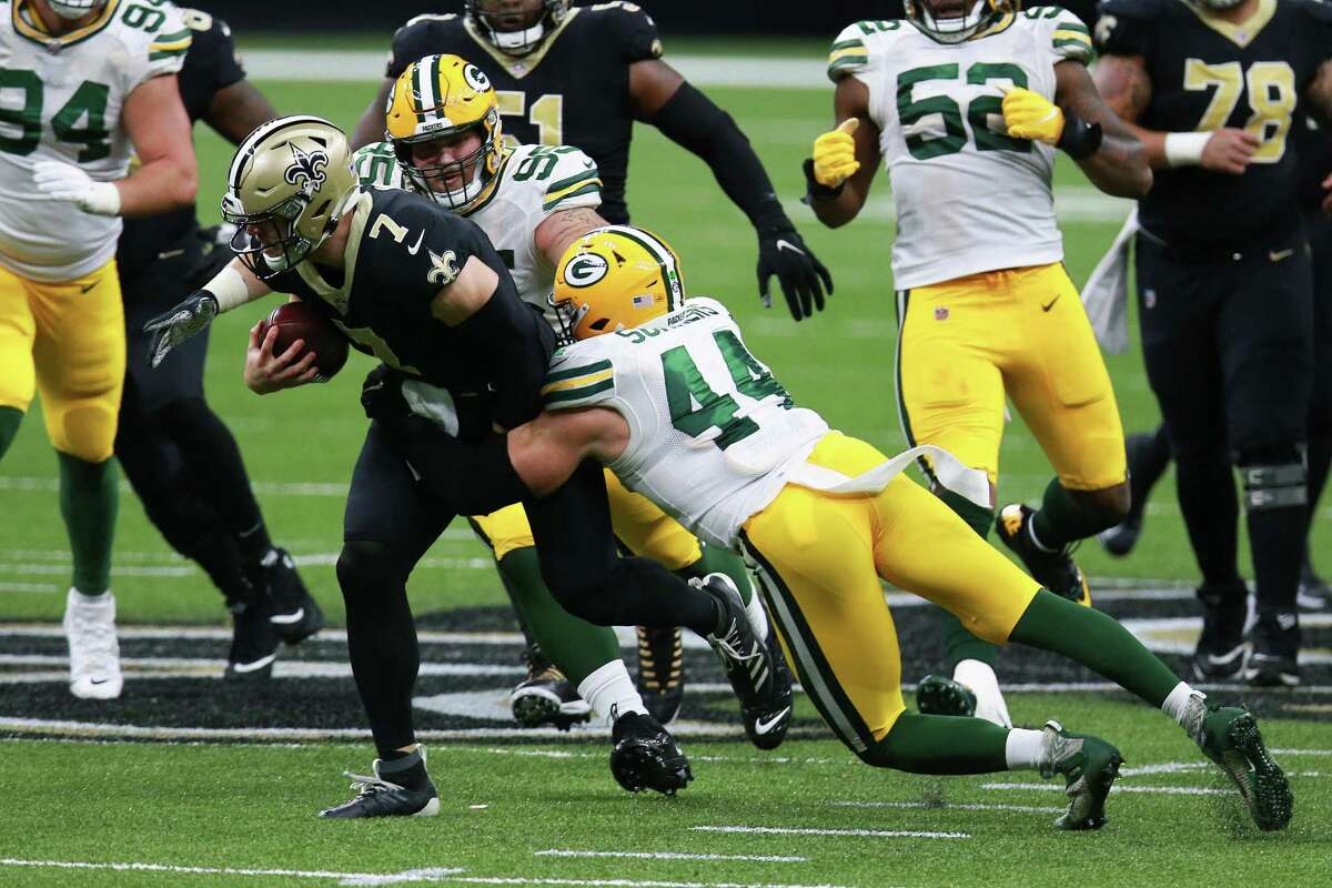 NEW ORLEANS, LOUISIANA - SEPTEMBER 27: Taysom Hill #7 of the New Orleans Saints is tackled by Ty Summers #44 of the Green Bay Packers during the second half at Mercedes-Benz Superdome on September 27, 2020 in New Orleans, Louisiana. (Photo by Sean Gardner/Getty Images)