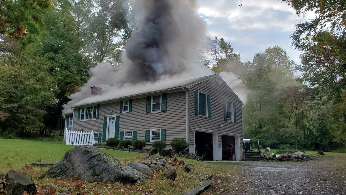 The house fire on Carriage Lane in Danbury, Conn., the morning of Oct. 6, 2020, that displaced seven people.