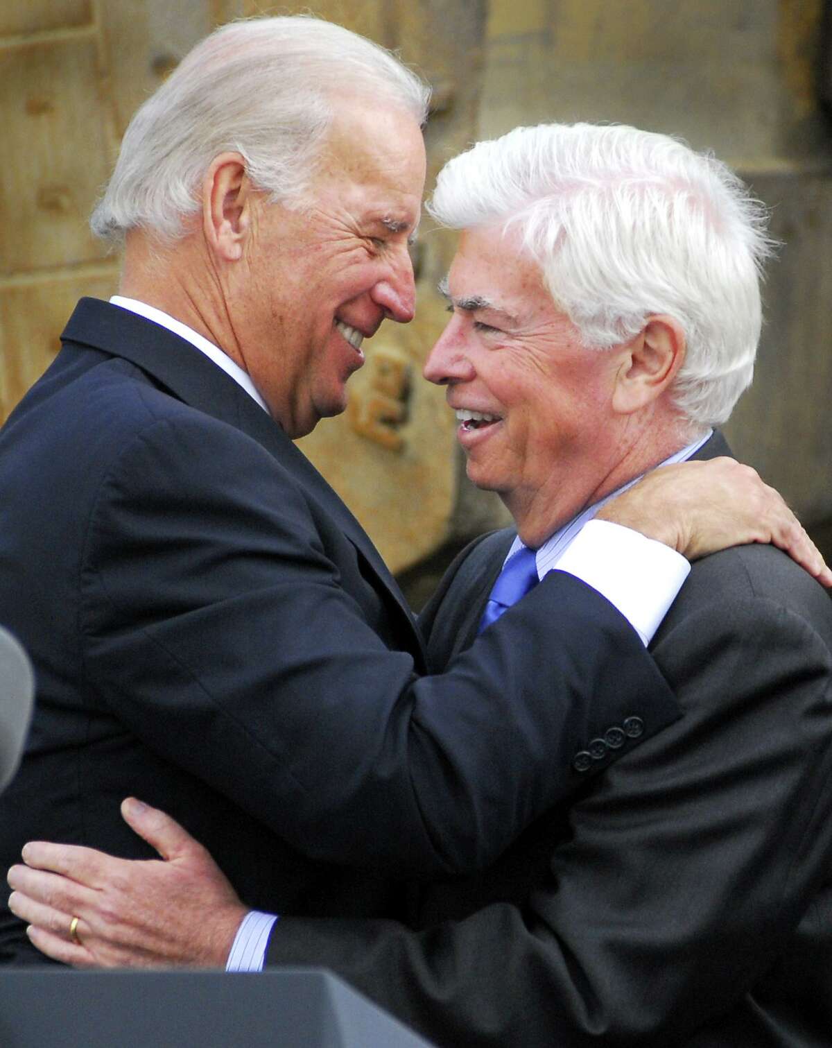 Photography by PETER HVIZDAK ph1153 #6182 Fairfield, Connecticut- October 5, 2009: U.S. Vice-President Joe Biden hugs U.S. Senator Chris Dodd after speaking at a Fairfield Park & Ride commuter parking lot on Jefferson Street in Fairfield near exit 46 by the Merritt Parkway. Biden tauted the Federal stimulus Recovery Act that pumped money into Merritt Parkway safety enchancements and road improvements. Biden was joined by U.S. Senator Chris Dodd and U.S. Representative Jim Himes. Himes is serving in his first term in Congress, while Dodd has been struggling with low poll numbers and faces a potential Democratic primary.