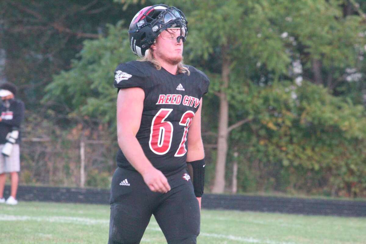 Blake VanAlstine comes off the field for Reed City during a timeout earlier this season. (Herald Review photo/John Raffel)