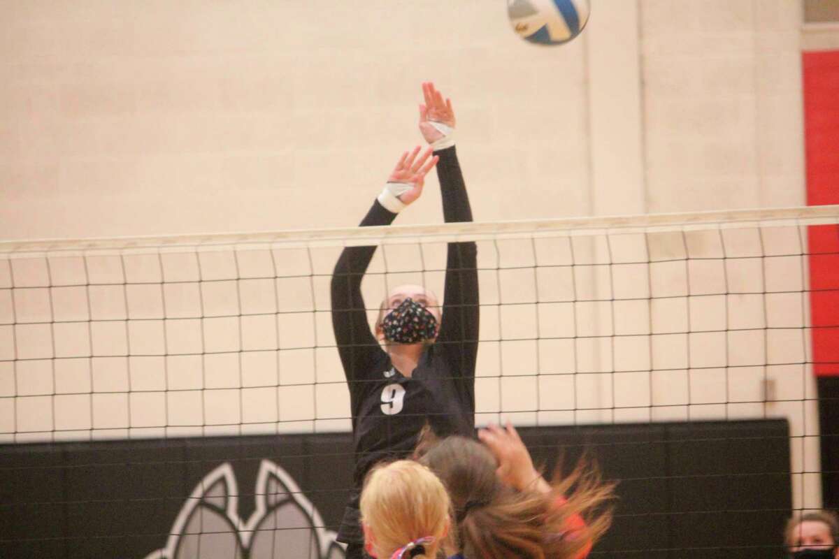 Christina Malackanich goes up for the ball for Reed City in recent action. (Herald Review photo/John Raffel)