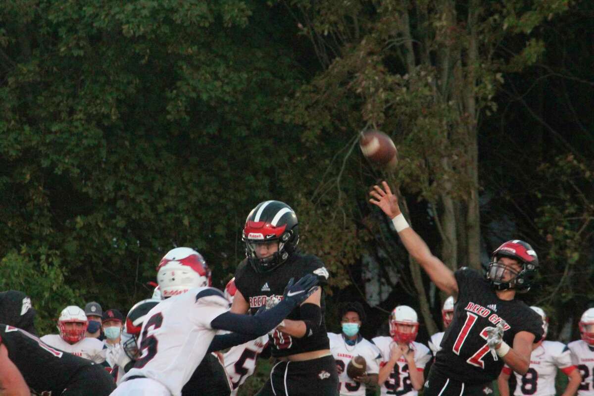 Reed City's Xavier Allen (12) throws a pass in action earlier this season. (Herald Review photo/John Raffel)
