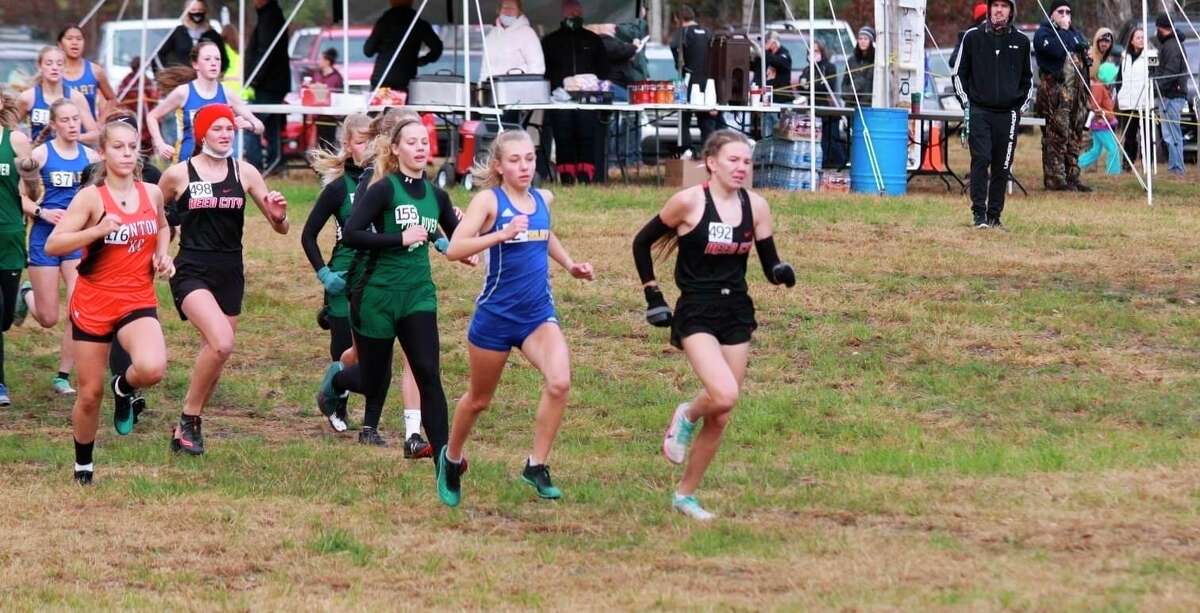 Reed City's Abbigail Kiaunis (right right) leads the pack at the Cecil Burch Invitational on Saturday. (Courtesy photo)