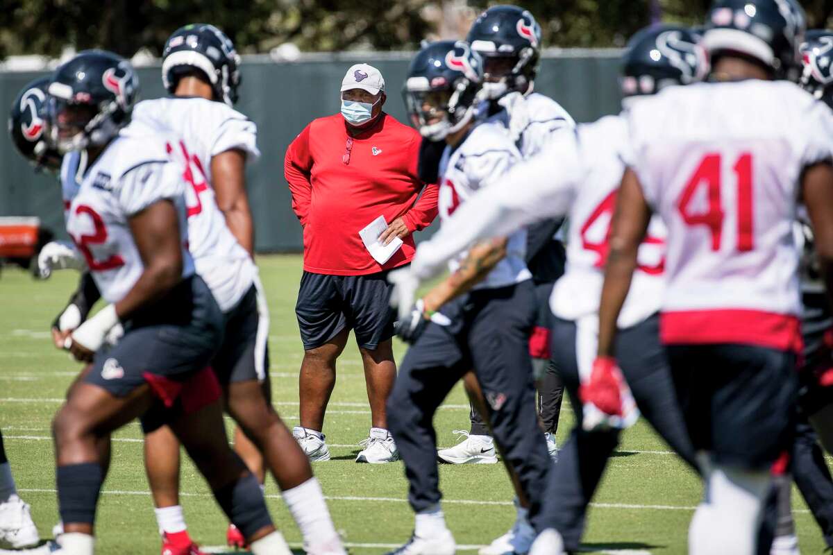 Houston Texans interim head coach Romeo Crennel watches his players warm up during his first practice leading the team Wednesday, Oct. 7, 2020, at The Houston Methodist Training Center in Houston. Crennel takes over for fired Houston head coach Bill O'Brien, who was fired this week after an 0-4 start.