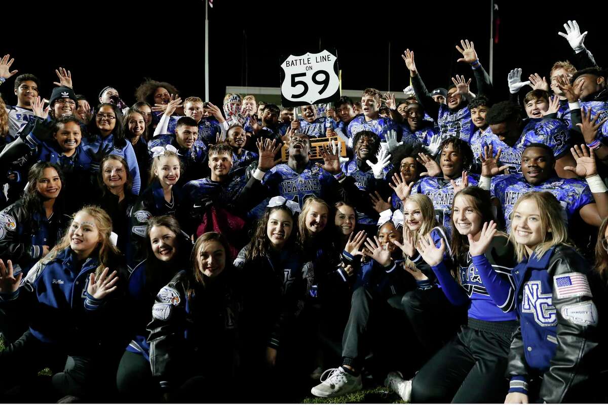 The New Caney Eagles celebrate with the “Battle Line on 59” trophy after defeating Porter in 2019. New Caney is 10-0 all-time in the series with the Spartans.