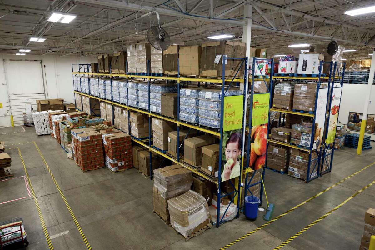 Pallets of food was stacked on shelves at the Montgomery County Food Bank in Conroe, Tuesday, July 21, 2020. John Kreger was recently announced as the Montgomery County Food Bank's new Chief Operating Officer, a position that CEO and President Kristine Marlow created to manage the behind-the-scenes operations of the food bank.