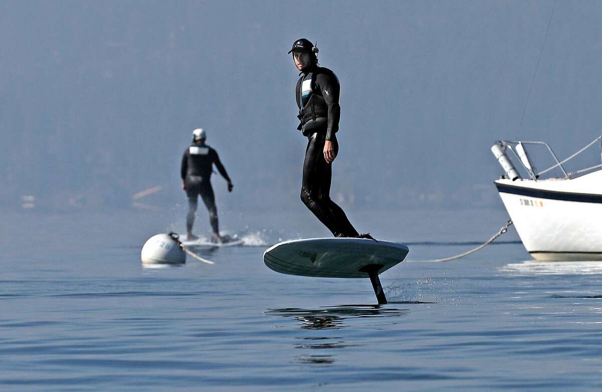 Instructor Matt Cook (right), along with student Connor Bugbee, during an efoil class at Kings Beach.