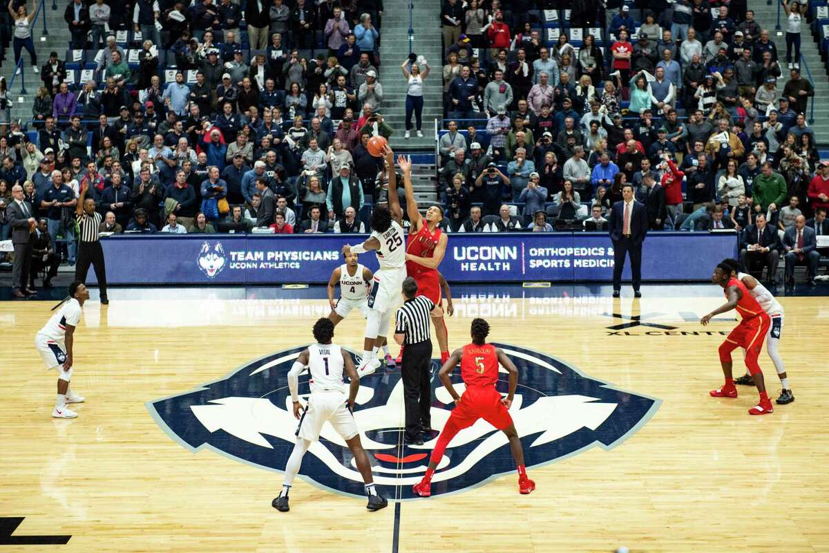 The UConn and Arizona men’s basketball teams tip off at the XL Center in Hartford in 2018. UConn will not play any basketball or hockey games there this season due to the pandemic.